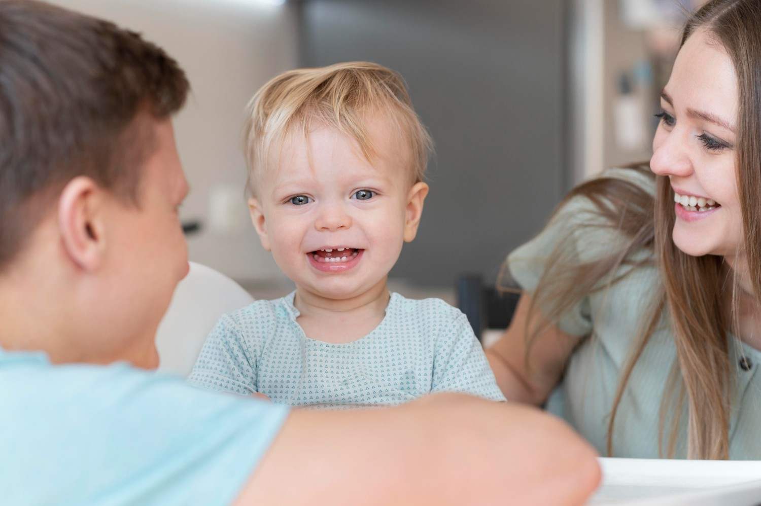 Happy parents with smiley toddler at Sunshine KiDDS Dentistry