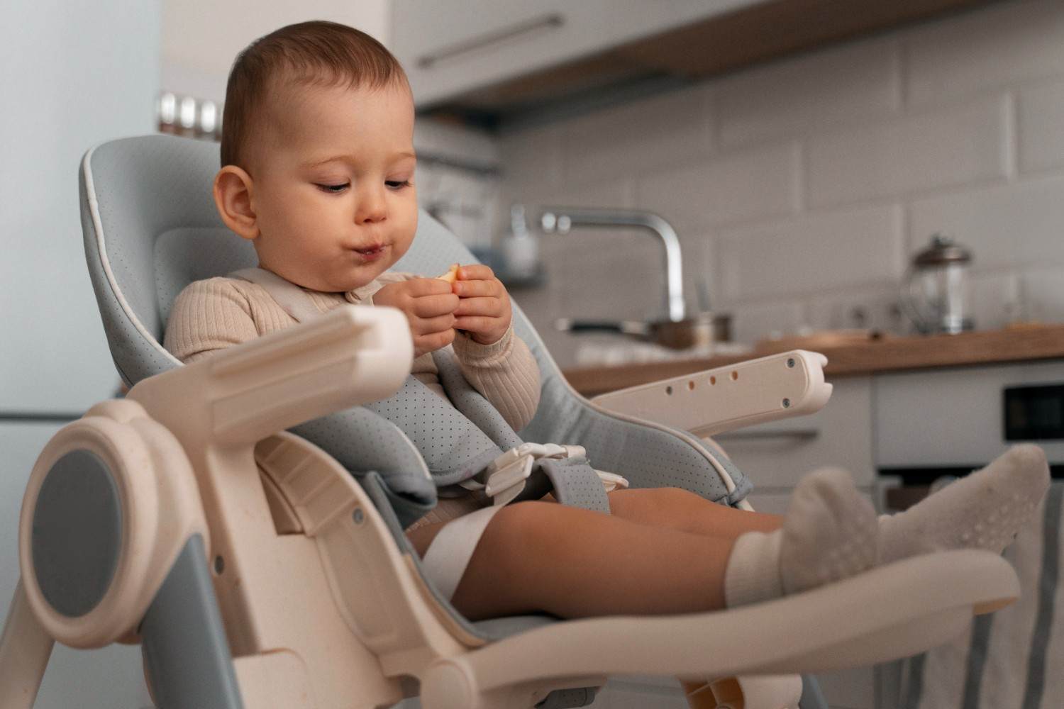 Parent and baby during a calm, positive first pediatric dental visit