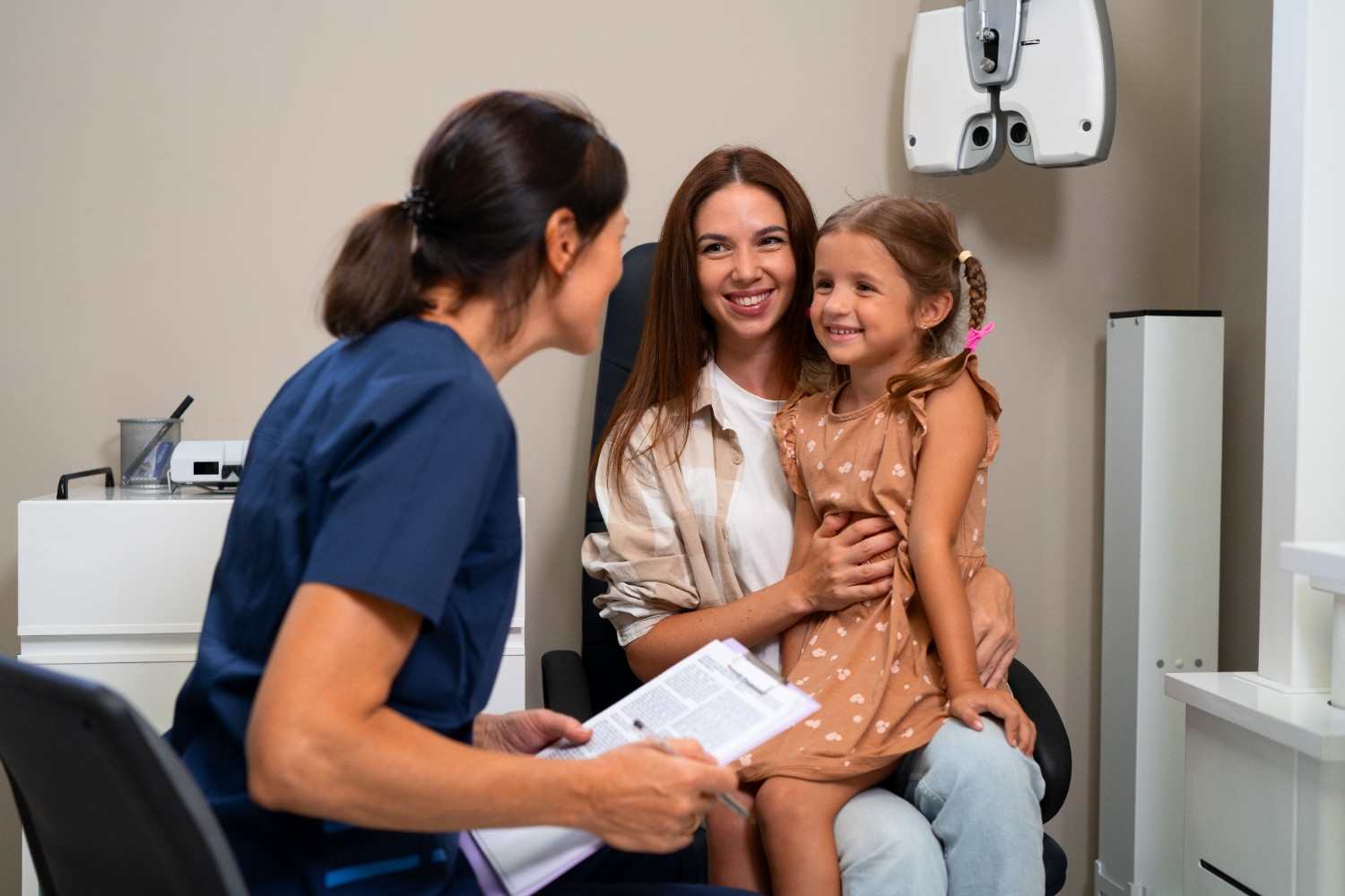 Child and parent talking with their doctor