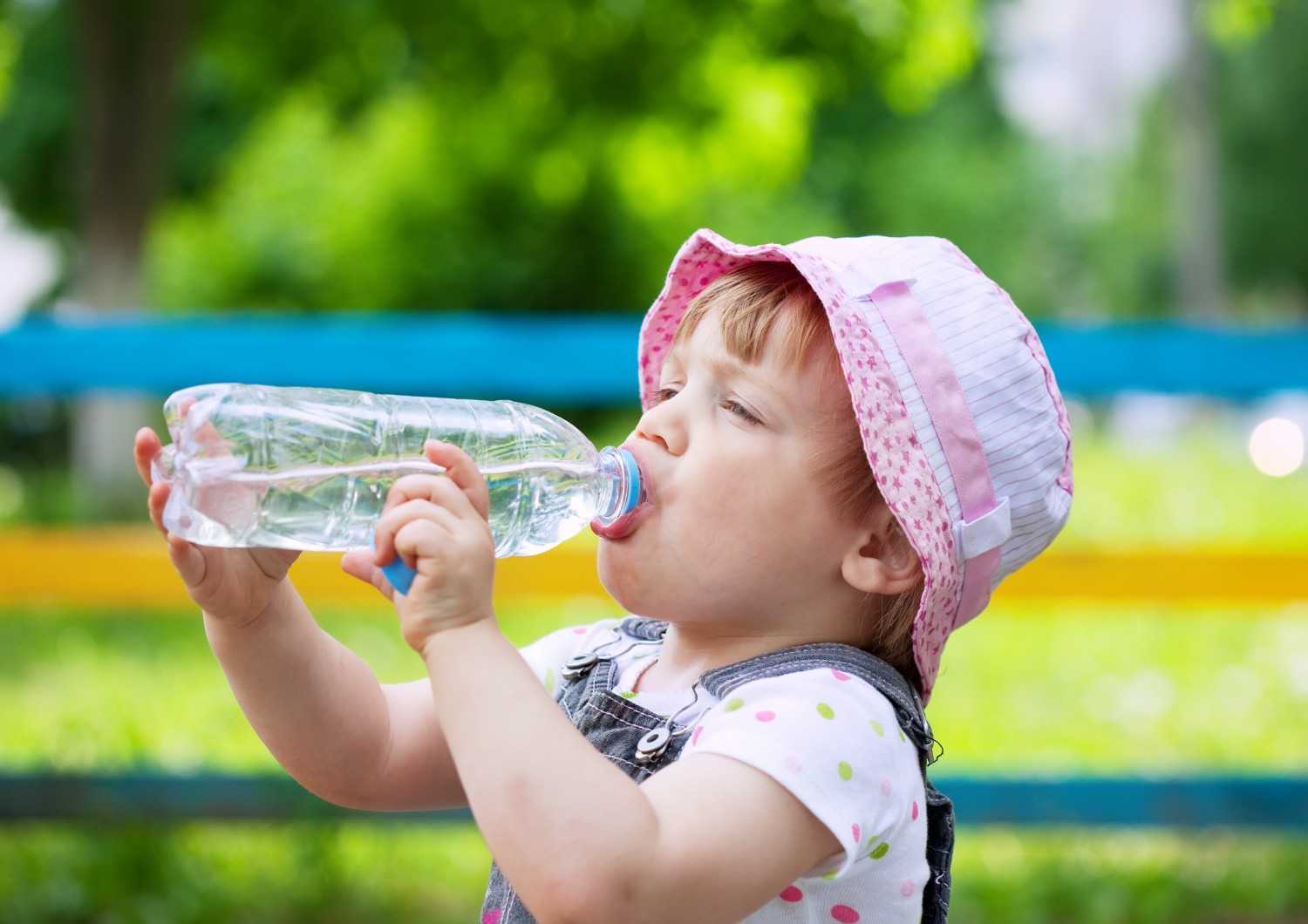 Two-year-old child drinking from a bottle, Sunshine KiDDS Dentistry